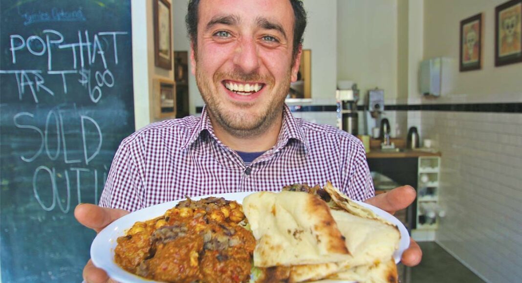 Simon-Ghorbani-Keep-Calm-Curry-On Simon Ghorbani holding curry