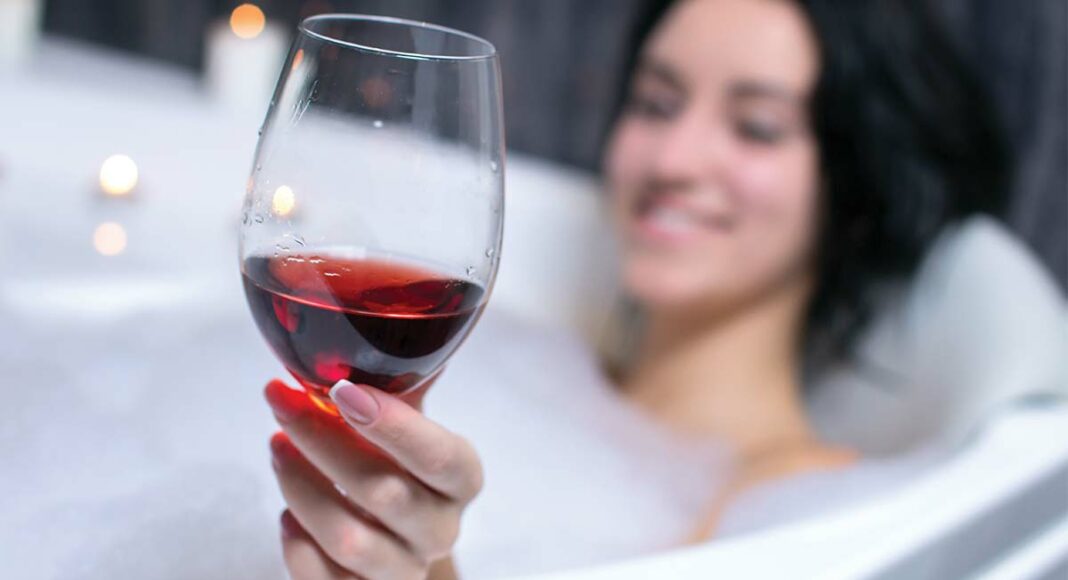 drinking wine in the jacuzzi