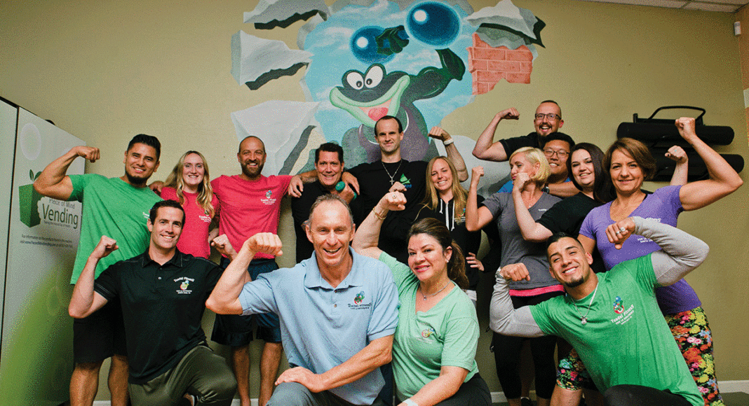 The trainers and staff of Toadal Fitness. Back row: Rudy Larin, Jennyn Jefferson, Nicolas Roure, Shawn Johnston, John Smith, Meigon Duncan, John McFadden, Travis Trinh. Middle Row: Michael Harbison, Marie Cambern, Moniquette Kaduk, Axel Ortiz. Front + Center: Christophe and Cecile Bellito. PHOTO: KEANA PARKER