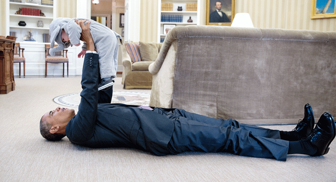 Pete Souza Barack Obama holding a baby