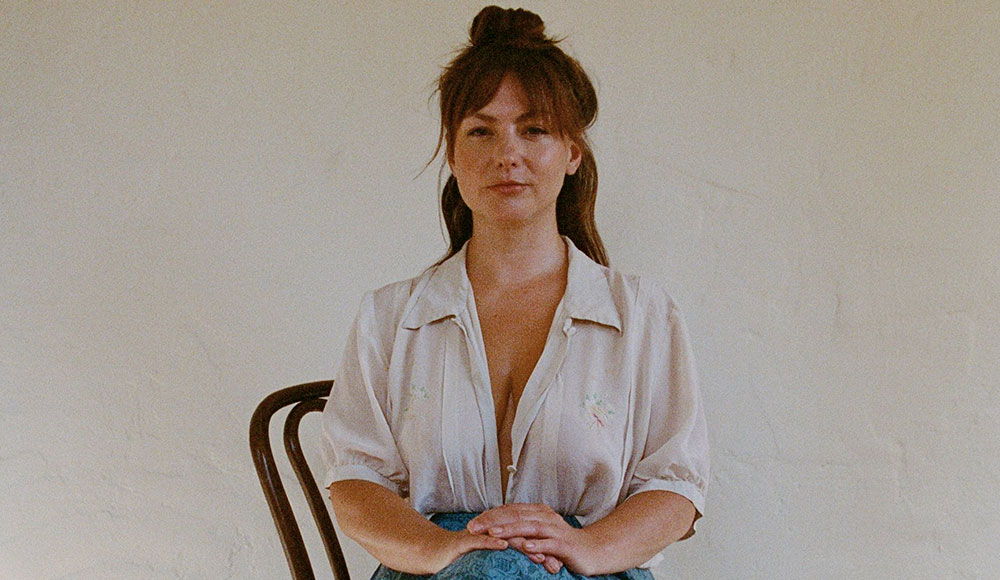 singer Angel Olsen seated for a full-face photo portrait