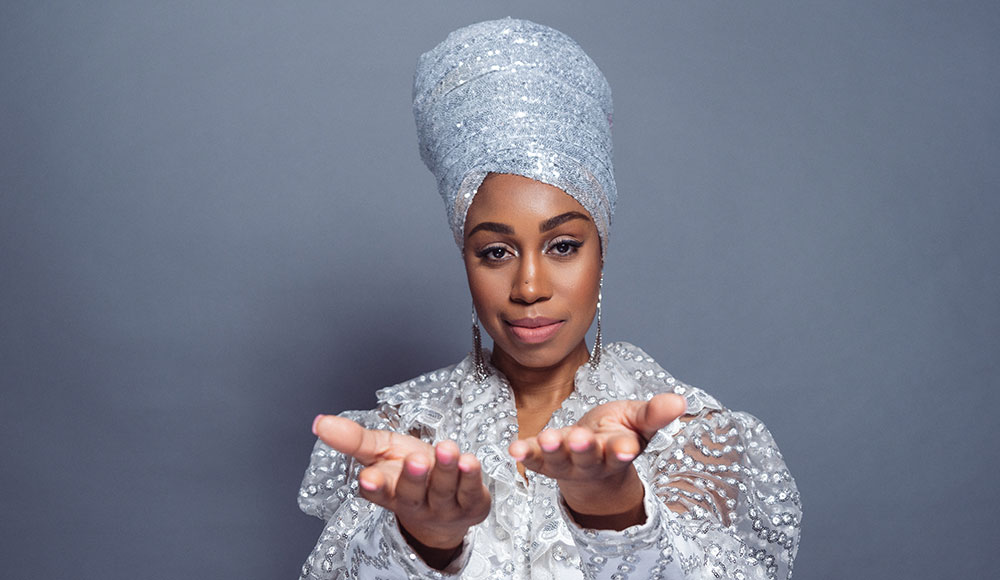 Jazz vocalist Jazzmeia Horn in sequined white african headwrap