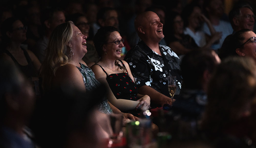 Laughing audience at a comedy club