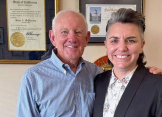 McPherson’s Legacy Man and a woman in an office