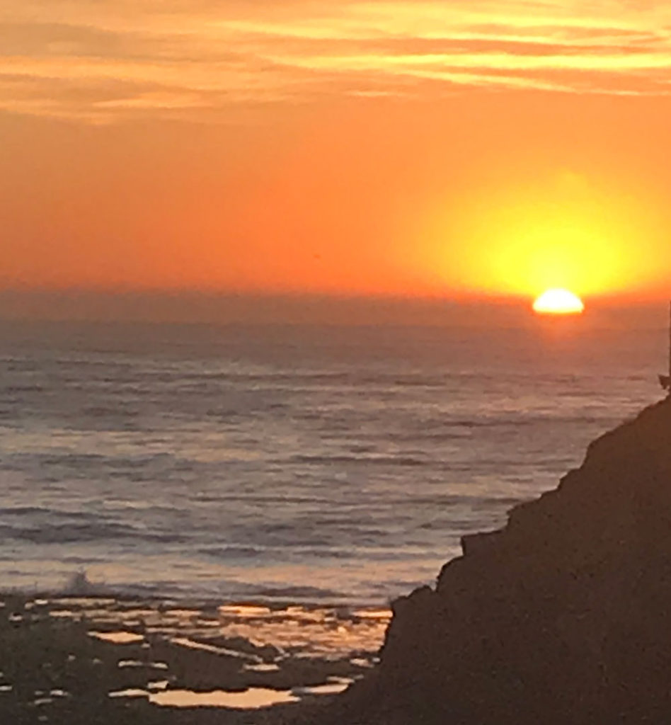 Sun setting into the ocean