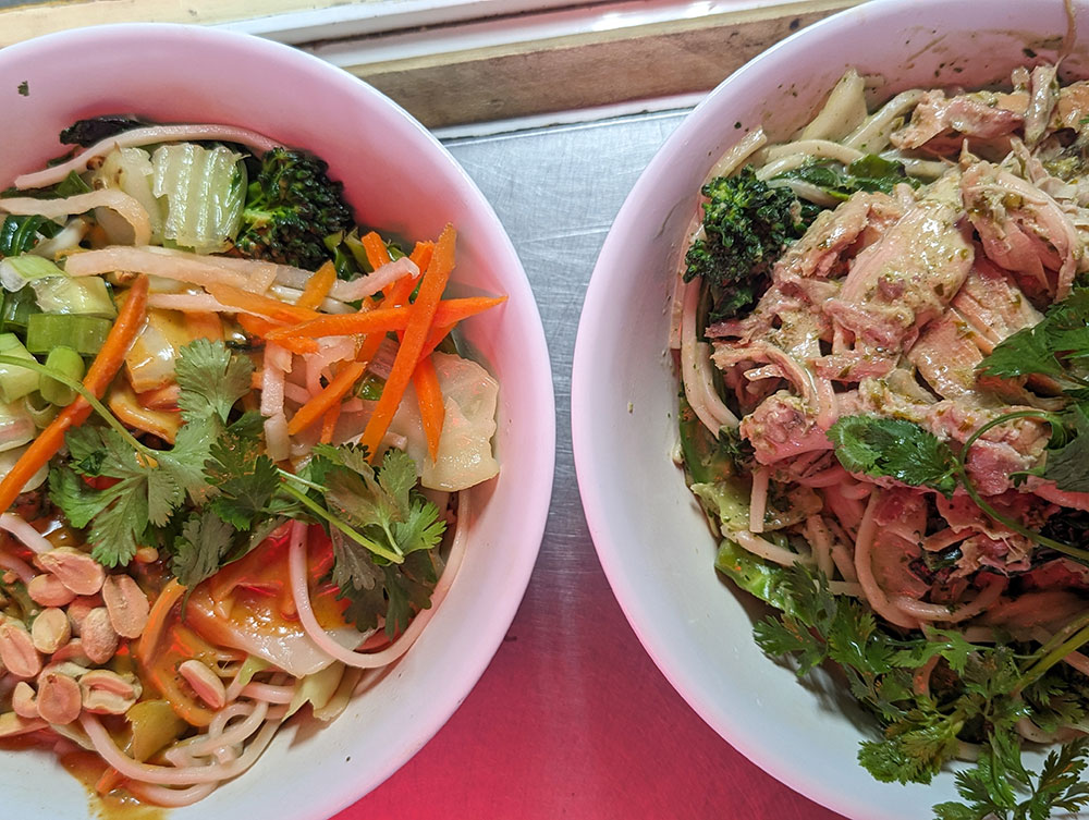 Two bowls of Asian-style noodle dishes