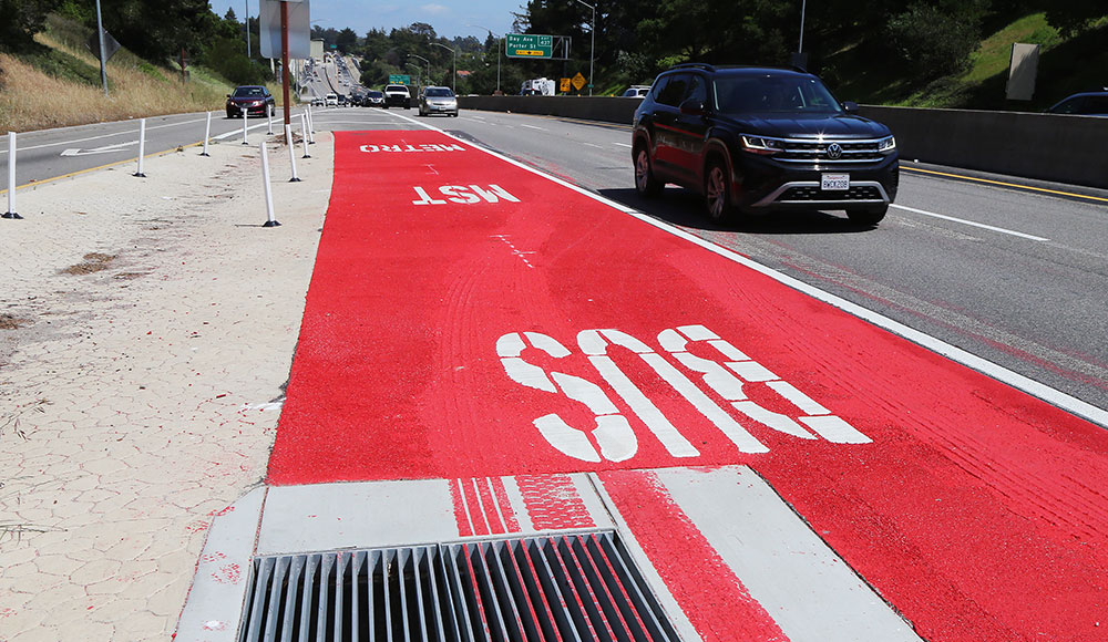 Lanes of the freeway with one painted bright red