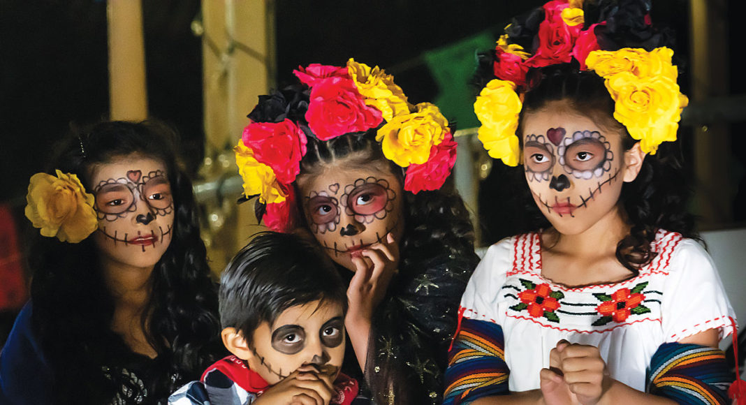 Kids in Day of the Dead makeup and costumes