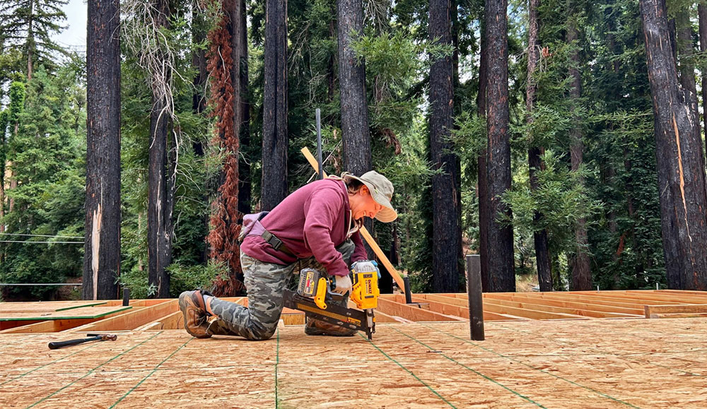 Woman using a tool on a construction site