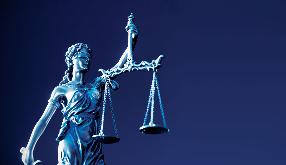 Statue of woman with scales of justice