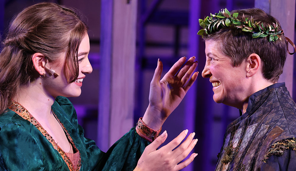 Two actors facing each other, dressed in period costumes