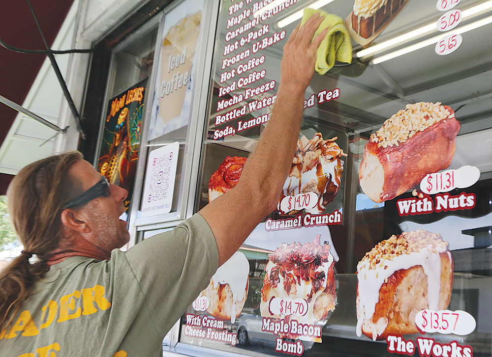 Man cleaning the window of a book at the County Fair