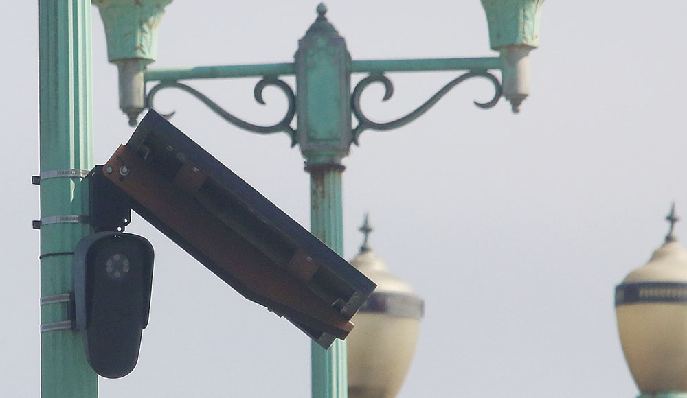 a Flock camera on a bridge