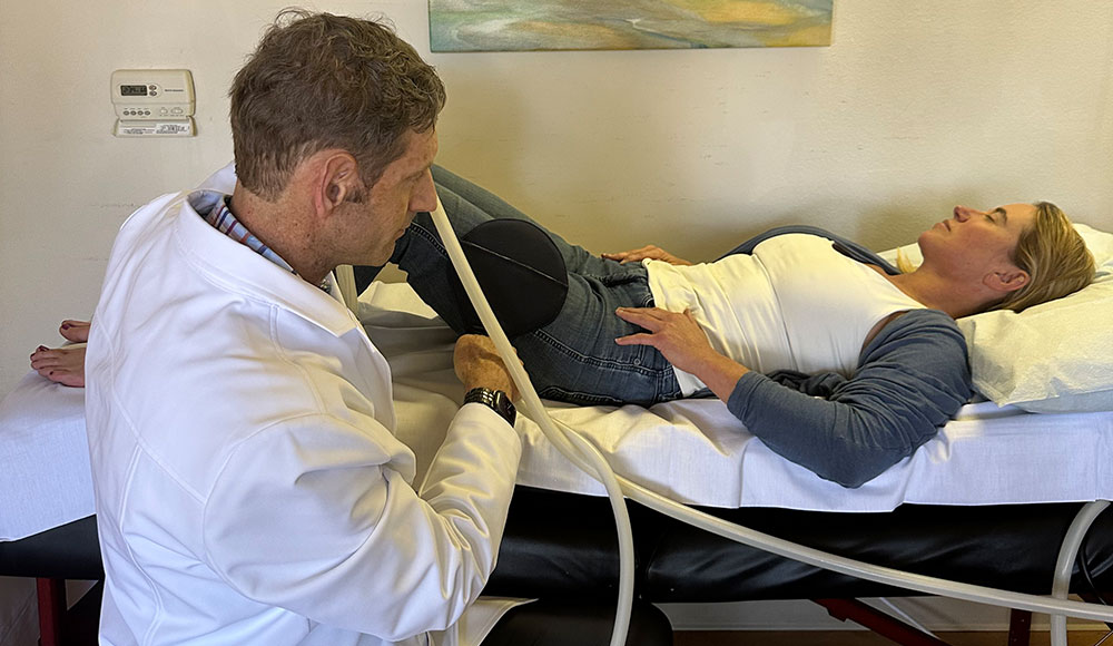 A doctor and patient getting inflammation therapy