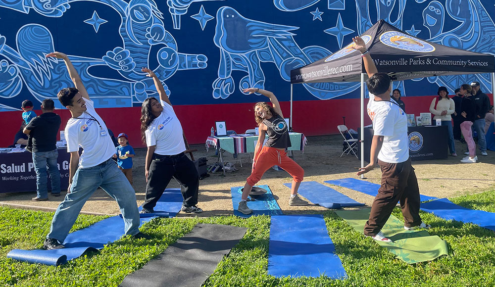 practicing yoga depicted with Yoga For All wellness story