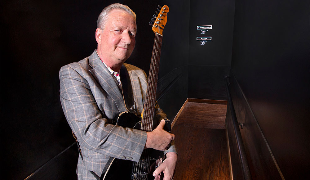Squeeze founding member Glenn Tilbrook with guitar