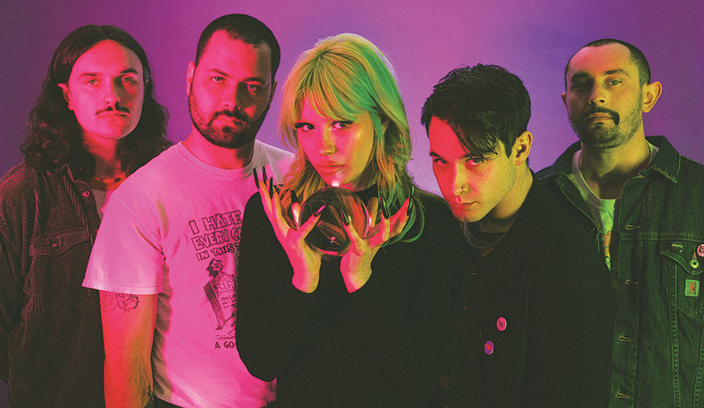 Group photo of the band Scowl, looking mystical.